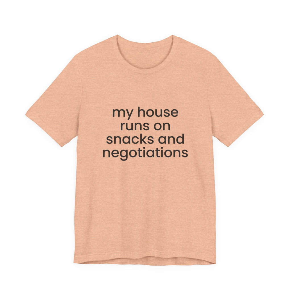 T‑Shirt — "My House Runs on Snacks and Negotiations" Funny Family Tee