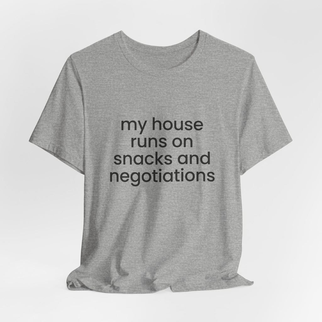 T‑Shirt — "My House Runs on Snacks and Negotiations" Funny Family Tee