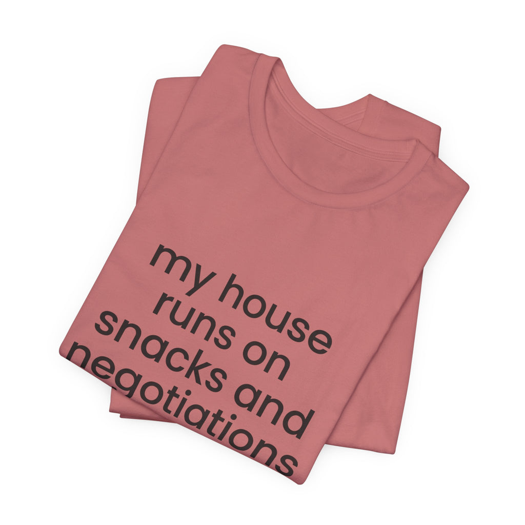 T‑Shirt — "My House Runs on Snacks and Negotiations" Funny Family Tee