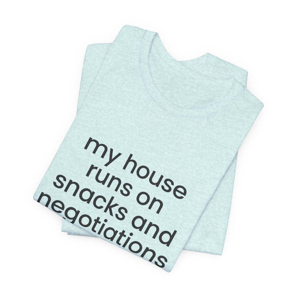 T‑Shirt — "My House Runs on Snacks and Negotiations" Funny Family Tee