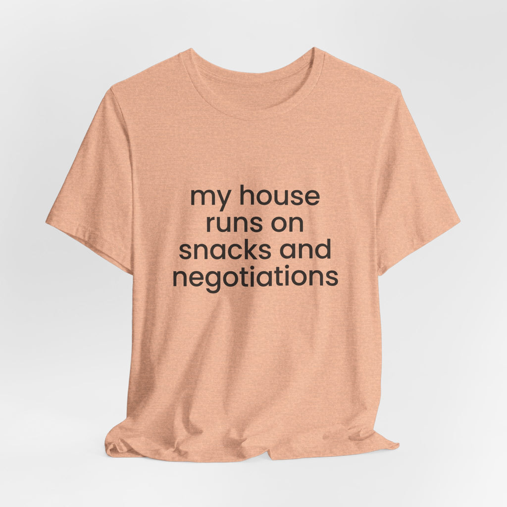 T‑Shirt — "My House Runs on Snacks and Negotiations" Funny Family Tee