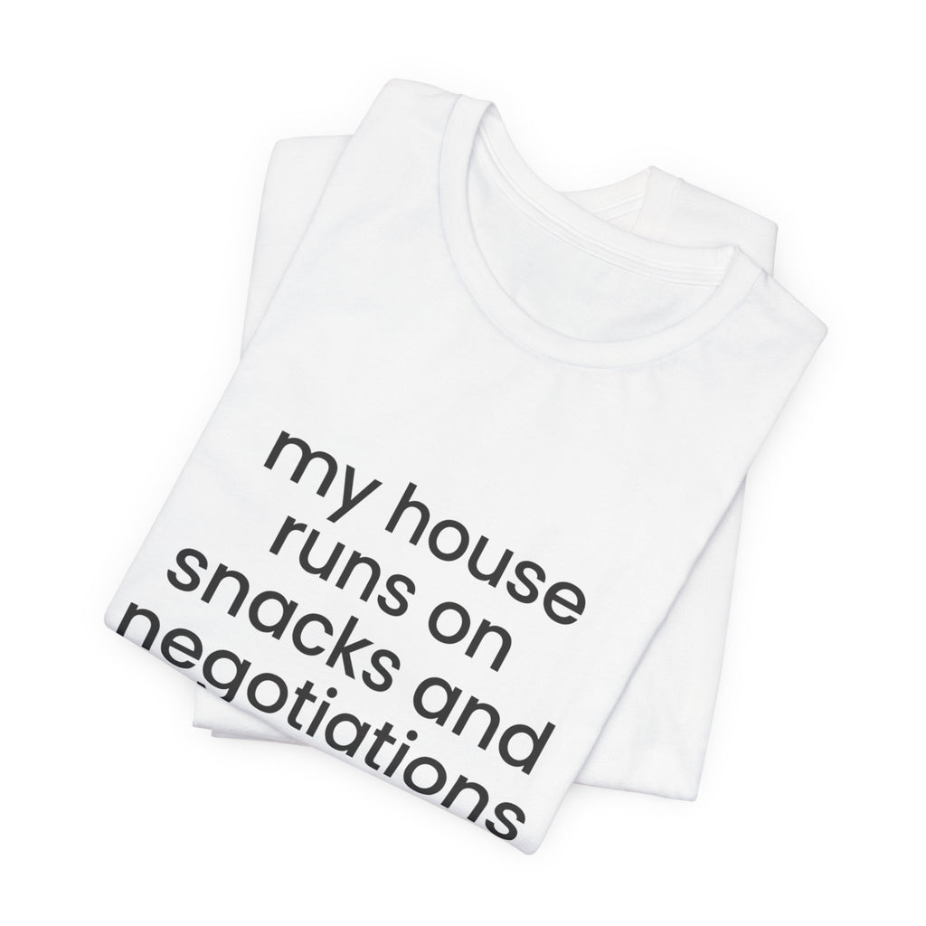 T‑Shirt — "My House Runs on Snacks and Negotiations" Funny Family Tee