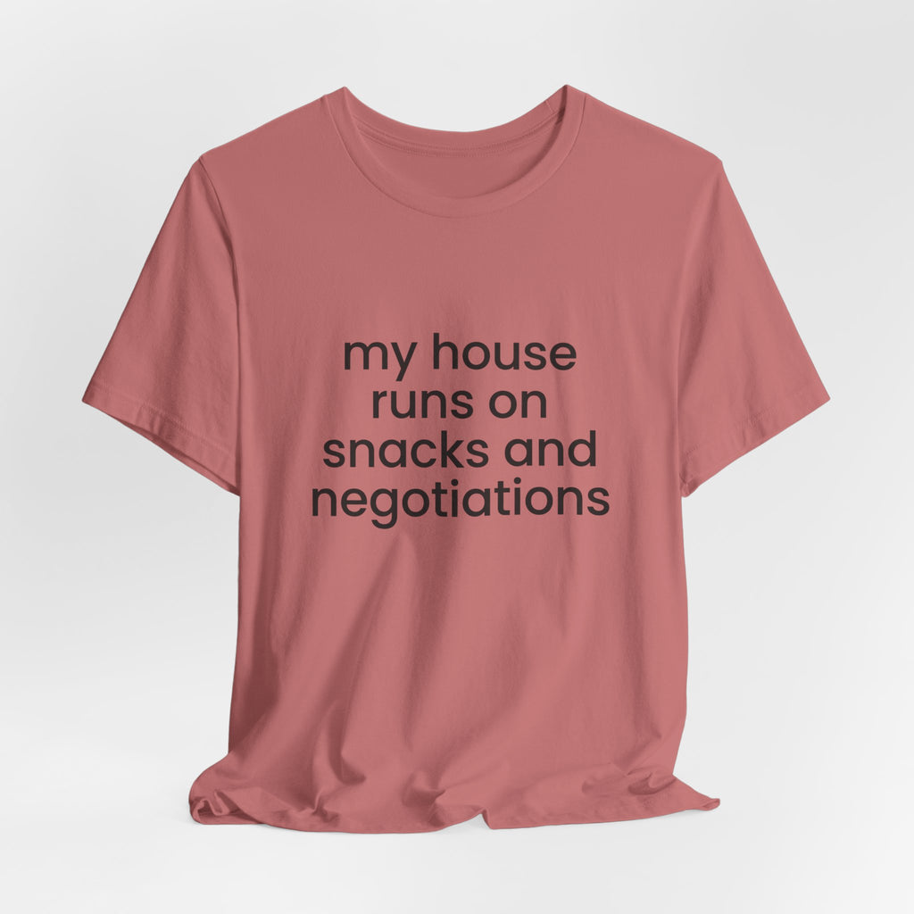 T‑Shirt — "My House Runs on Snacks and Negotiations" Funny Family Tee