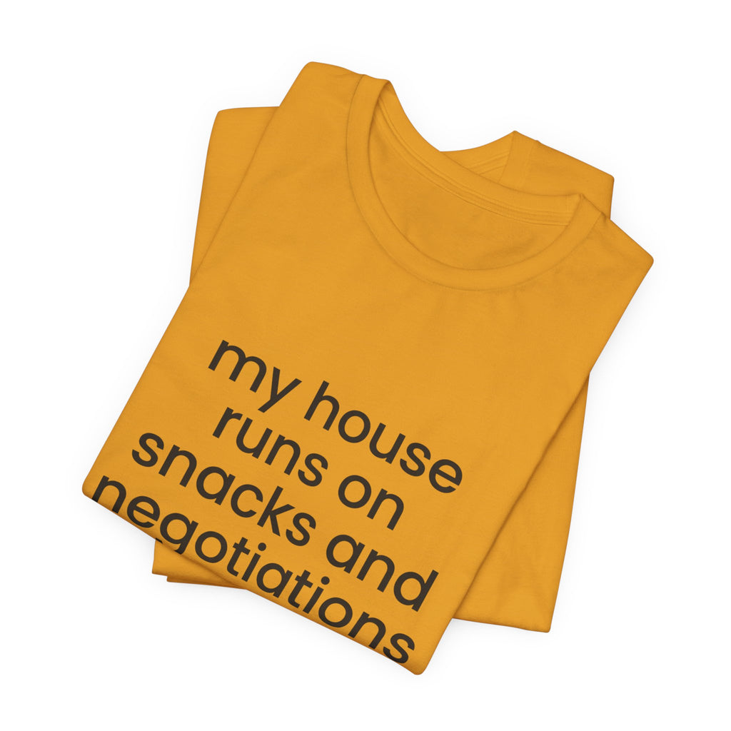 T‑Shirt — "My House Runs on Snacks and Negotiations" Funny Family Tee
